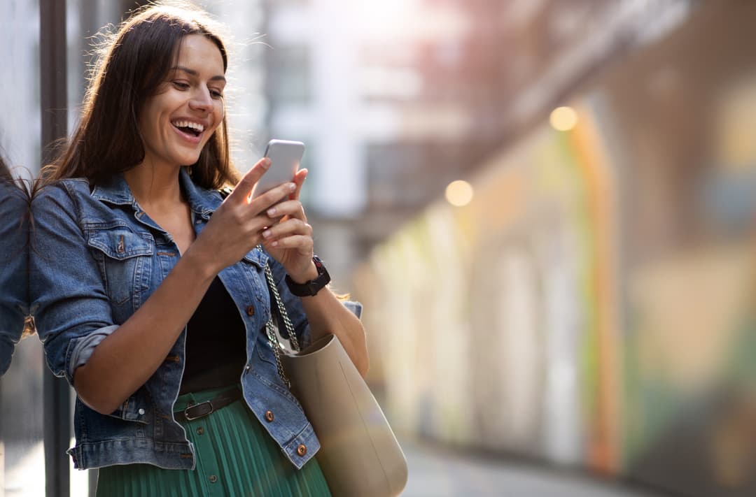 Woman using a phone outdoors