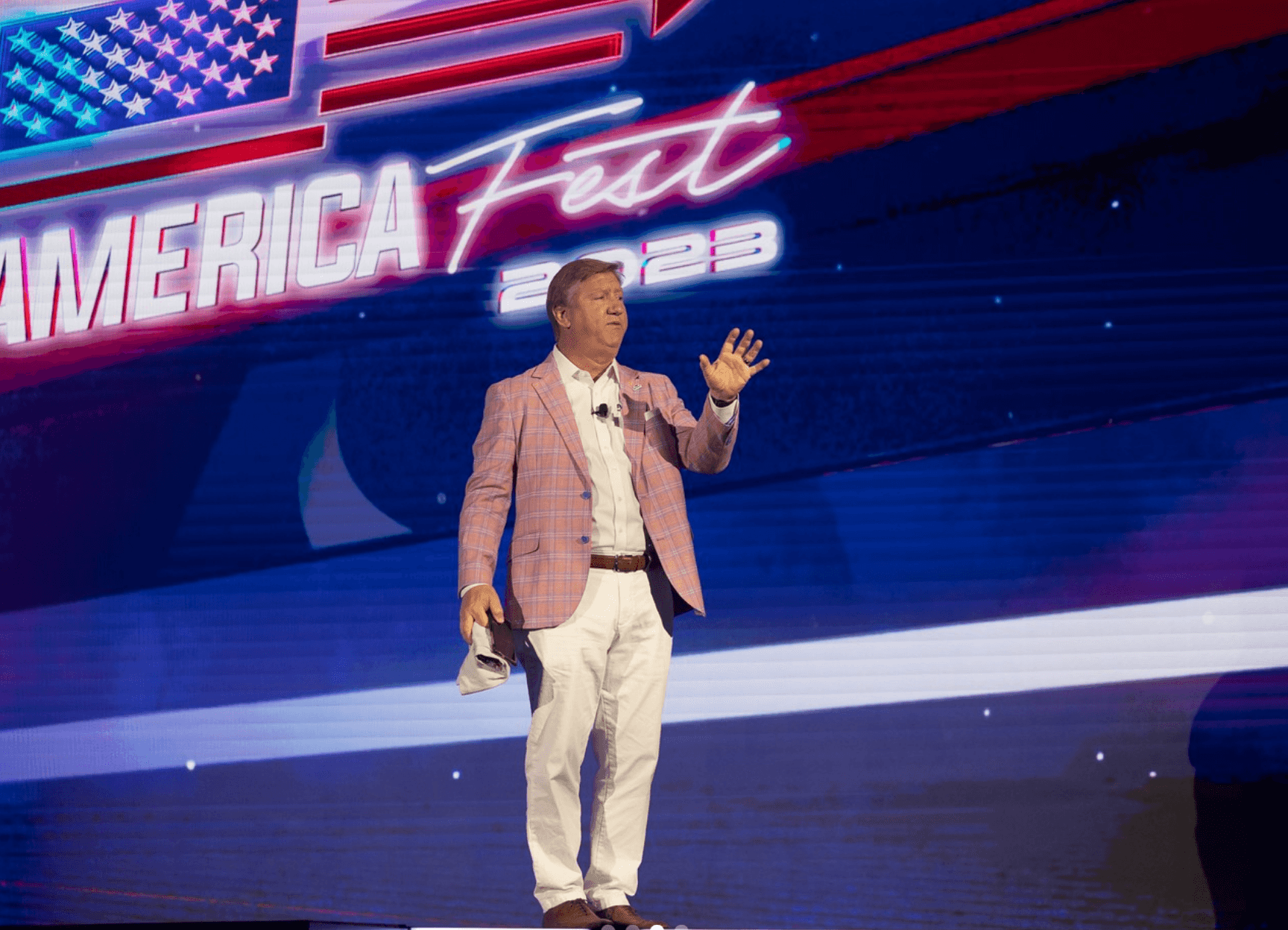 Speaker on the AmericaFest 2023 stage