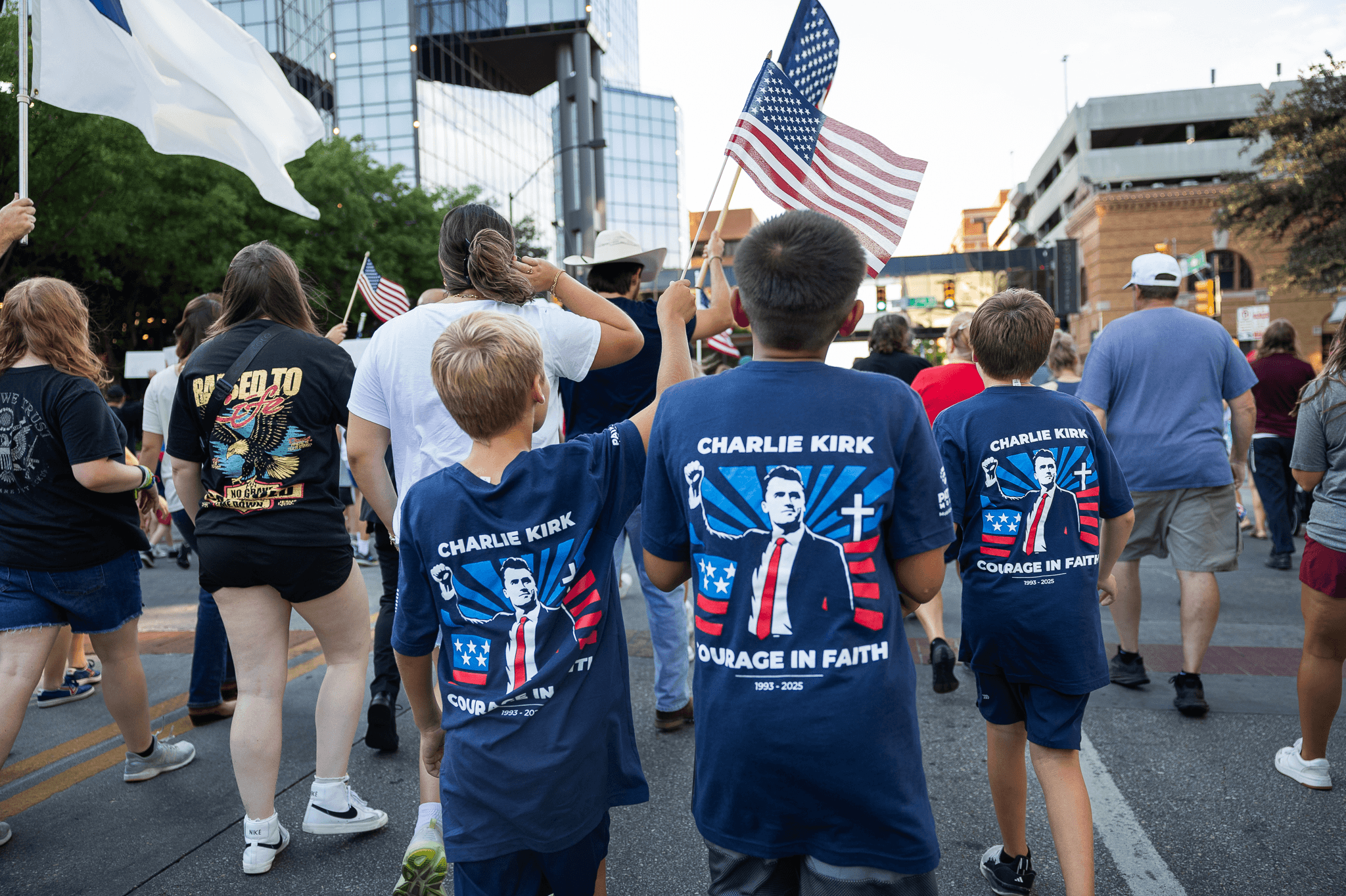 People walking together with American flags