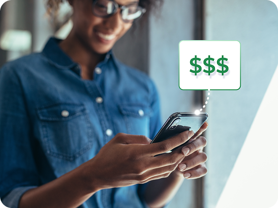 Woman holding phone with money symbols